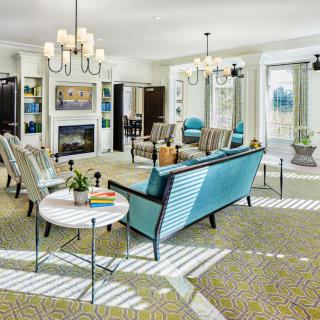 A beautifully decorated modern living room with stylish furniture and bright lighting.