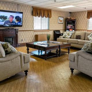 A cozy living room with comfortable sofas and a television.