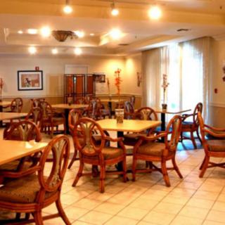 Elegant dining area with wooden tables and chairs.