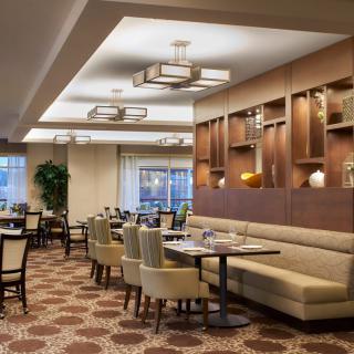 A modern dining area with stylish decor and comfortable seating.