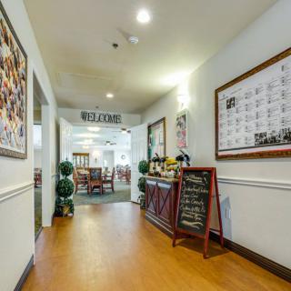 View of a restaurant hallway with decorated walls and a welcoming atmosphere.