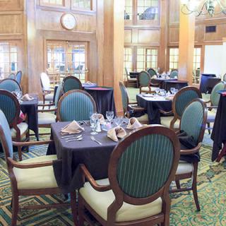 Elegant dining room with tables set for service.