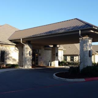 Entrance to a hospitality facility showcasing modern architecture.