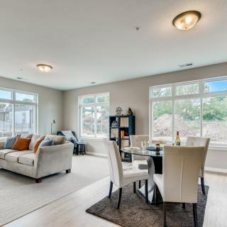 A spacious living and dining area with modern decor and ample natural light.