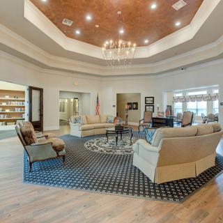 Luxurious lobby area with comfortable seating and elegant chandelier lighting.