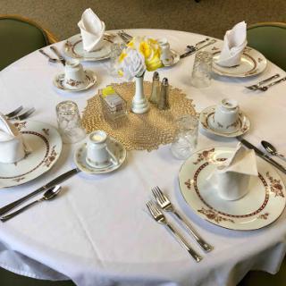 An elegantly arranged dining table, perfect for a formal meal.