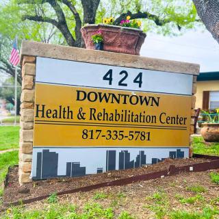 Sign for Downtown Health & Rehabilitation Center with contact number.