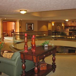 A hotel lobby with cozy seating and elegant decor.