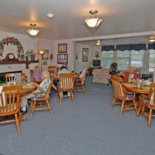 A cozy dining area where individuals enjoy their meals together.