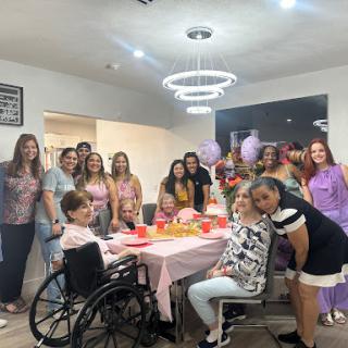 A joyful birthday celebration surrounded by friends and family.