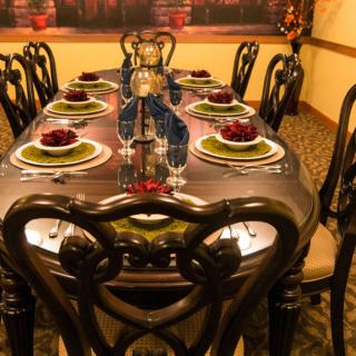 An elegantly set dining table prepared for a formal dinner.