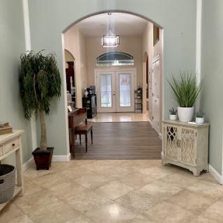 A welcoming entrance showcasing elegant decor and greenery.