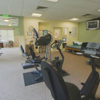 An indoor gym with exercise bikes and other fitness equipment.