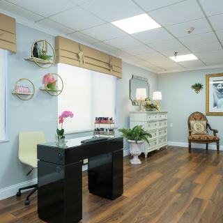 A modern office interior with stylish decor and wooden flooring.