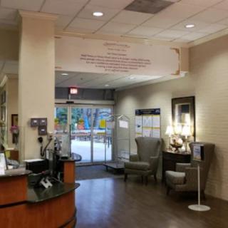 A welcoming lobby area with seating and decor near an entrance.