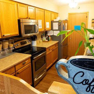 Warm and inviting kitchen space with modern appliances and wooden cabinetry.