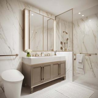 A modern and luxurious bathroom with marble walls, a vanity with large mirrors, and a glass-enclosed shower.