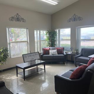 A cozy living room bathed in natural light, featuring modern furniture and decorative accents.