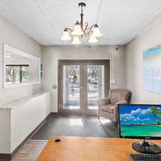 A welcoming lobby space featuring comfortable seating, modern decor, and ample natural light.