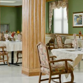 A well-decorated dining area with tables and chairs arranged neatly.
