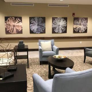 A modern lobby with stylish seating and abstract artwork.