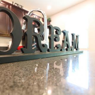 A stylish decorative piece that inspires dreams in a cozy kitchen setting.