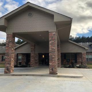 The welcoming entrance of a community building, showcasing modern architectural design.