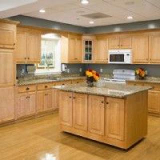 Modern kitchen with wooden cabinets and a central island.