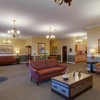 A spacious and elegantly decorated lobby with comfortable seating and warm lighting.
