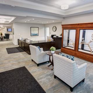 A modern lobby with comfortable seating and a reception desk.