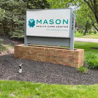 Signage for Mason Health Care Center located in a landscaped area.