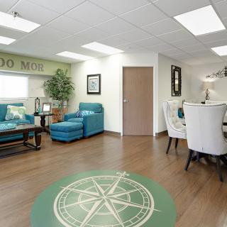 A modern office lobby or waiting room with comfortable seating and stylish decor.