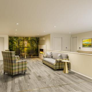 A modern living room featuring comfortable seating and elegant decor.