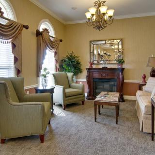A traditional living room with elegant furnishings and decor.