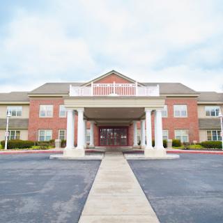 A welcoming hotel entrance with classic architecture and well-maintained surroundings.