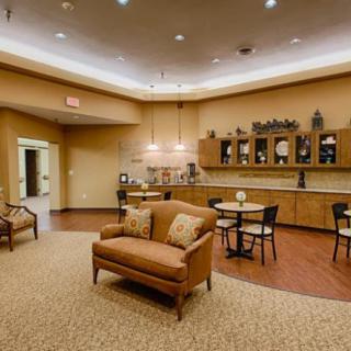 A cozy lounge area with comfortable seating and warm lighting.