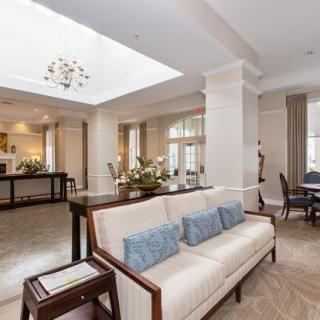 A modern living room with elegant furniture and bright, open spaces.