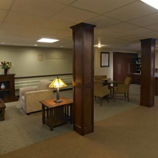 A spacious lobby area with comfortable seating and warm lighting.