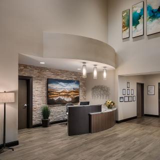 A modern and elegant reception area with stylish decor and artwork.