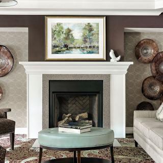 A modern living room with a central fireplace, surrounded by elegant decor and comfortable furniture.