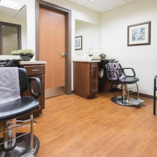 A well-organized barber or salon space featuring styling chairs and a welcoming atmosphere.