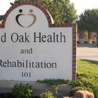Signage for Red Oak Health and Rehabilitation, indicating a healthcare facility.