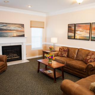 A cozy living room with warm decor and comfortable seating.