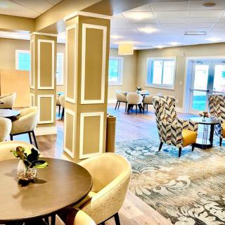 A modern and stylish lounge area featuring comfortable seating and elegant decor.