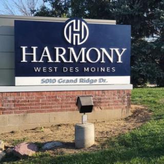 Sign for Harmony in West Des Moines displaying the address 5400 Grand Ridge Dr.