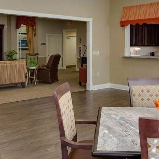 A cozy interior dining area with a view into the kitchen and living space.