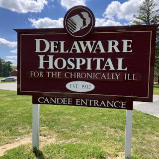 Sign for Delaware Hospital for the Chronically Ill, indicating the Candise Entrance.