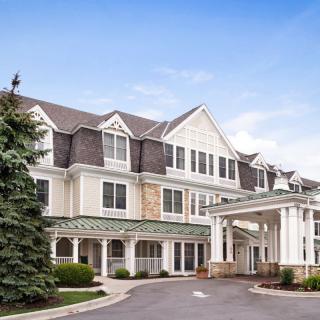 A large hotel building with traditional architecture and a welcoming entrance.