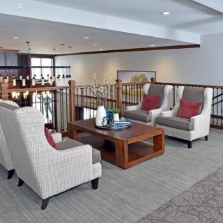 A modern and cozy living room with comfortable seating and a wooden coffee table.