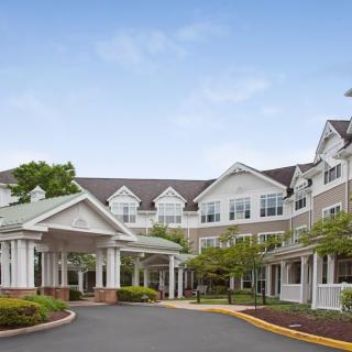 A well-maintained residential building with a welcoming entrance and landscaped surroundings.